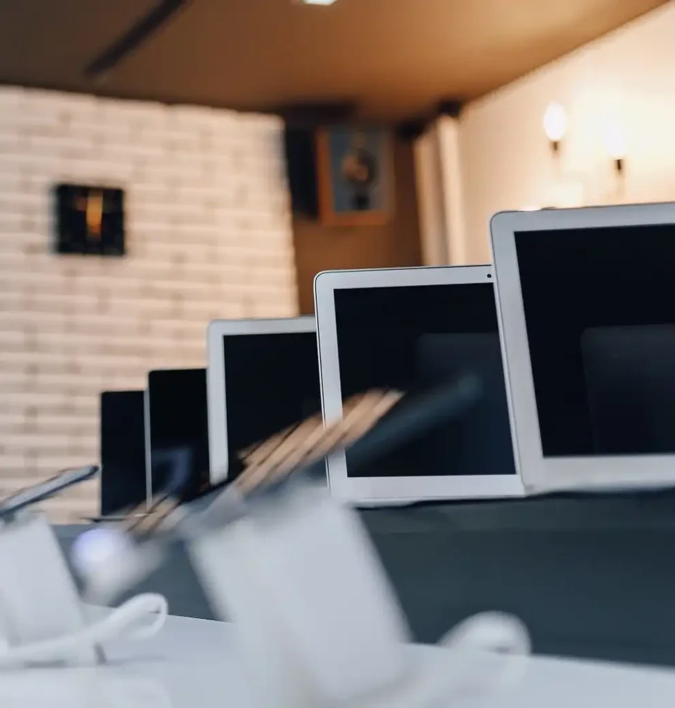 Laptops and tablets on display in a shop